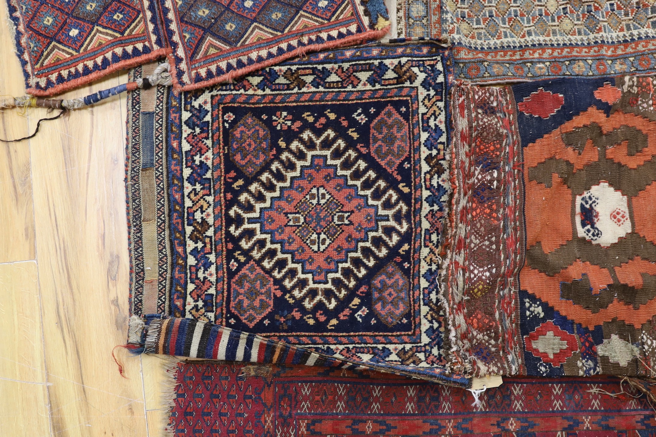 Two carpet saddlebags: Kasquai and a Shamdavan salt bag, a Kilim panel, a Soumac and a Tekke fragment